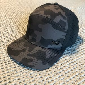 Melin Trenches Icon Hydro performance perforated hat in black camo